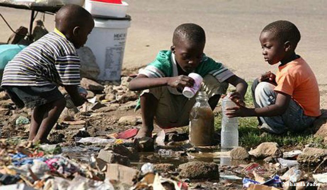 Children playing with dirty water in Lusaka